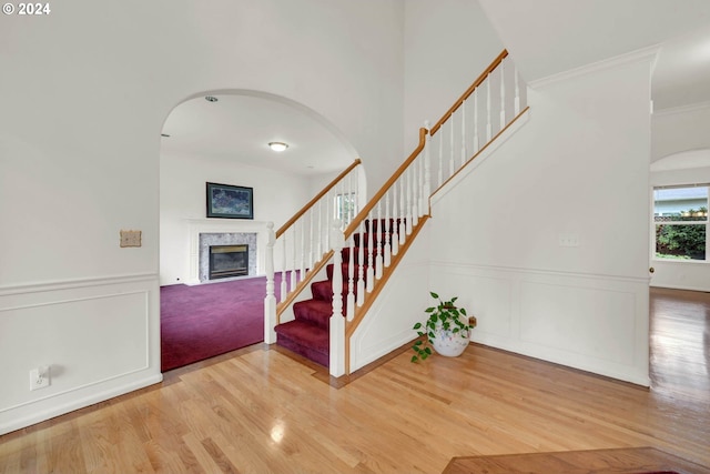 entryway featuring ornamental molding and wood-type flooring