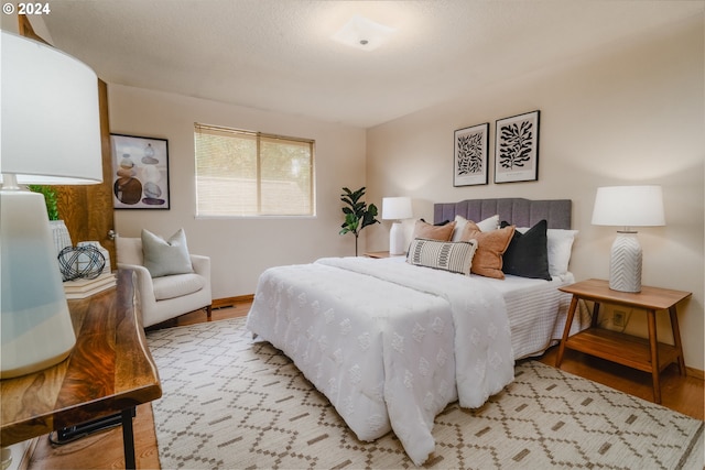 bedroom with light wood-type flooring