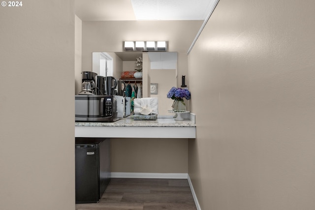 bathroom with hardwood / wood-style flooring