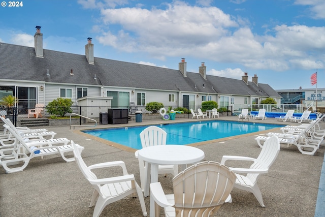 view of swimming pool with a patio