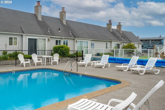 view of swimming pool featuring a patio