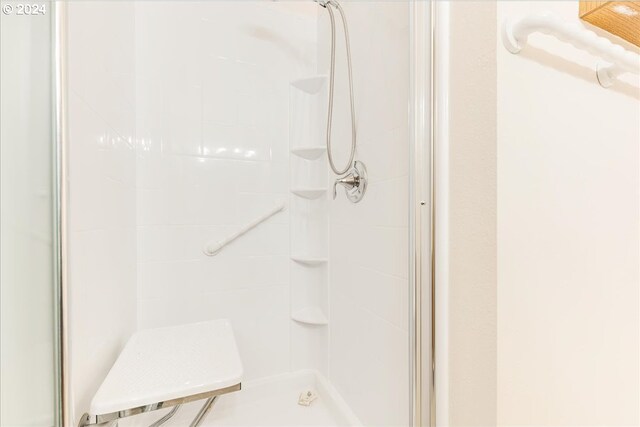 bathroom with tiled shower