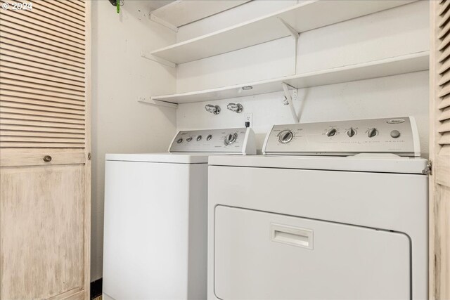 washroom featuring independent washer and dryer