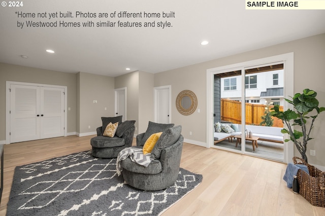 living room with light hardwood / wood-style flooring