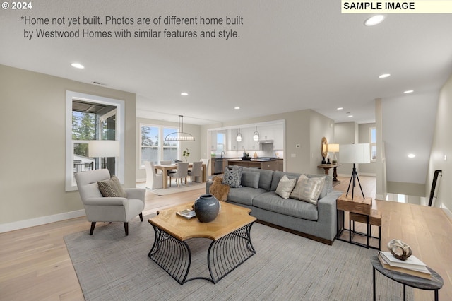 living room with light hardwood / wood-style floors