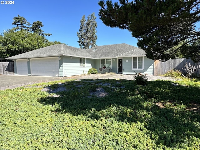 single story home featuring a garage