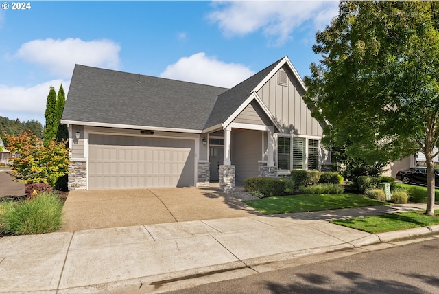 view of front of house with a front yard and a garage