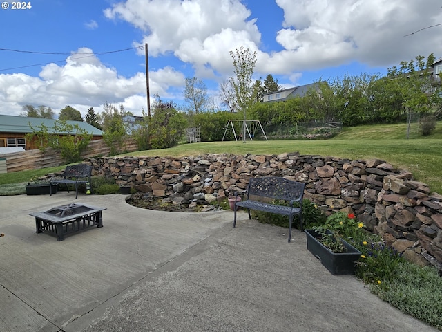 view of patio with an outdoor fire pit