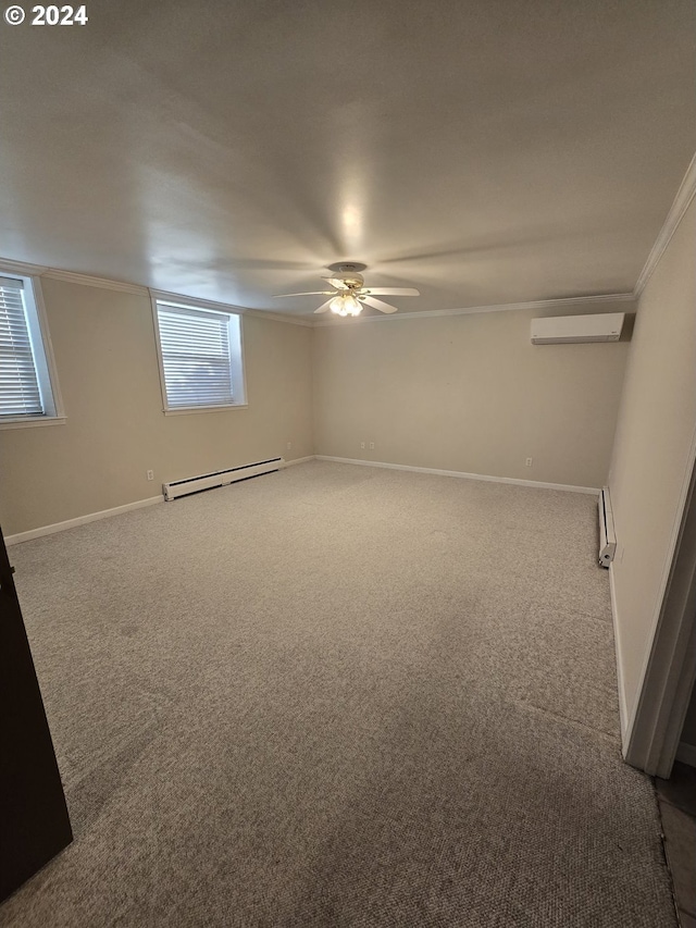 basement featuring carpet, a wall mounted AC, a baseboard heating unit, and crown molding