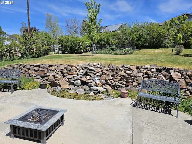 view of patio / terrace with an outdoor fire pit