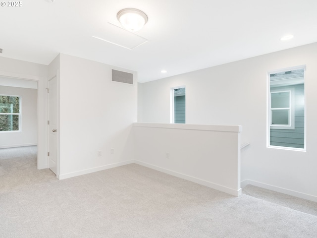 empty room featuring light colored carpet