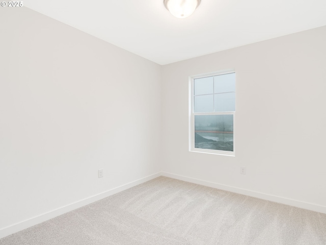 unfurnished room featuring carpet flooring