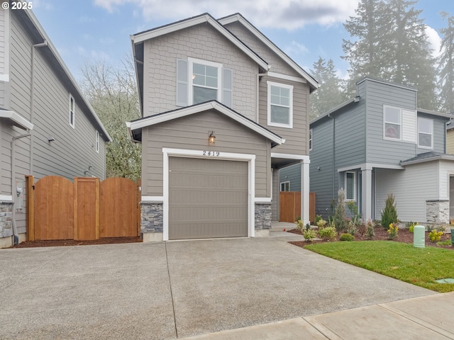 craftsman-style home featuring a garage and a front lawn