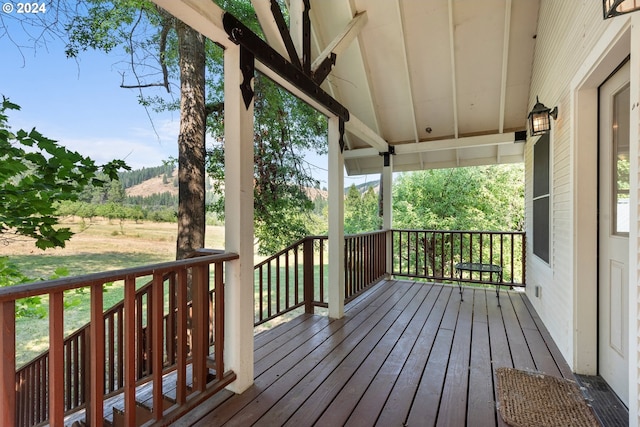 wooden terrace featuring covered porch