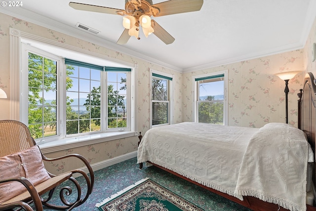 bedroom with ceiling fan and ornamental molding