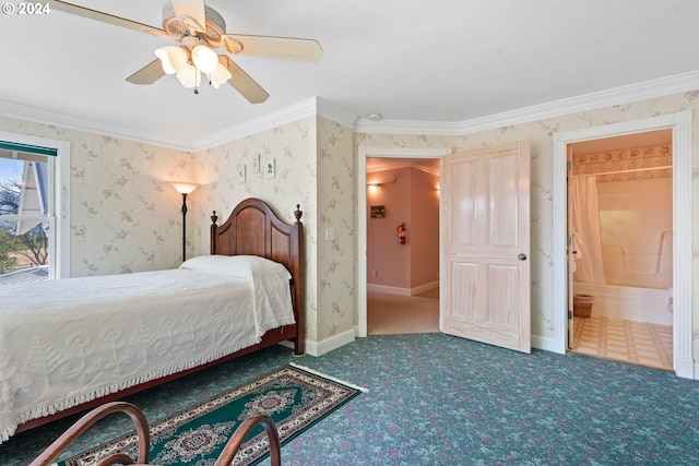 carpeted bedroom featuring ornamental molding, ensuite bathroom, and ceiling fan