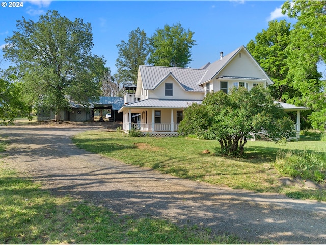 view of front of property with a front lawn and covered porch