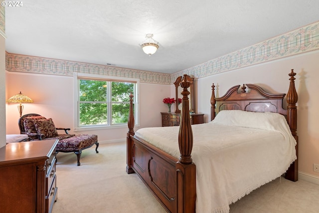 bedroom with light colored carpet