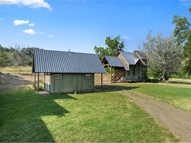 view of outbuilding with a yard