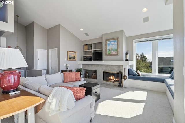 living room featuring light carpet, a fireplace, and vaulted ceiling