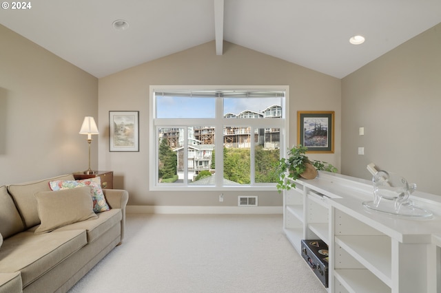 interior space with lofted ceiling with beams and light carpet