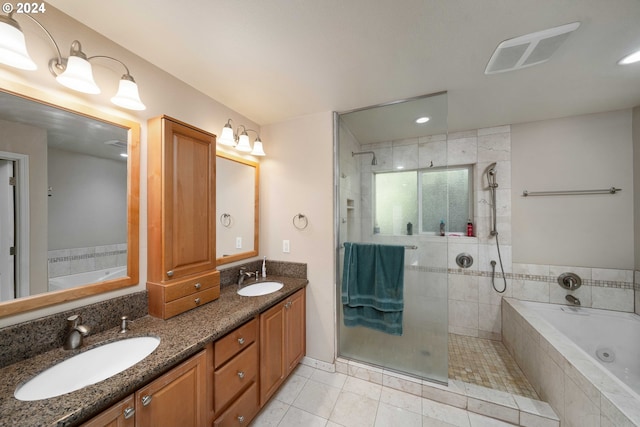 10909 SW Adele Dr, Portland, OR 97225 - bathroom featuring a stall shower, a bath, double vanity, tile patterned flooring, and recessed lighting