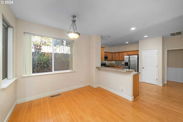 10909 SW Adele Dr, Portland, OR 97225 - kitchen featuring stainless steel appliances, light wood finished floors, baseboards, and recessed lighting