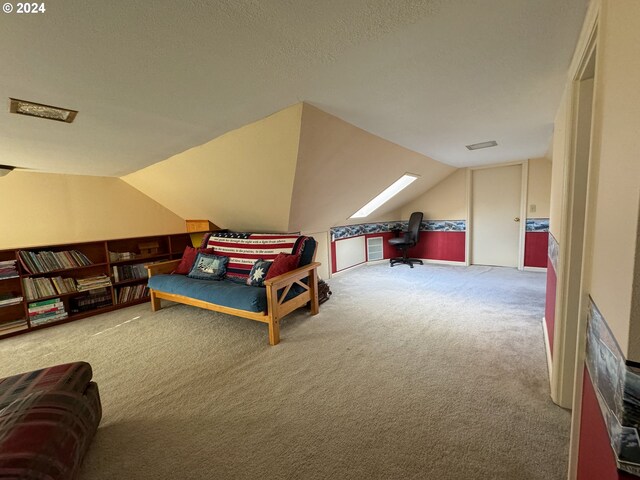 carpeted bedroom with vaulted ceiling