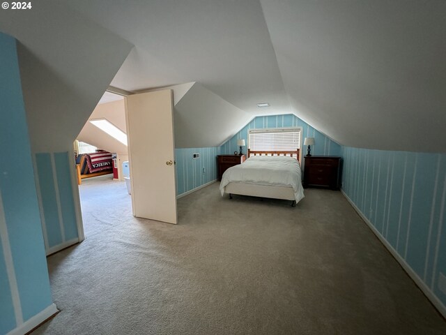 unfurnished bedroom featuring carpet and lofted ceiling