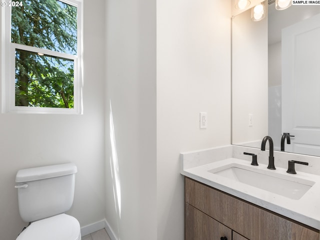 bathroom with vanity and toilet