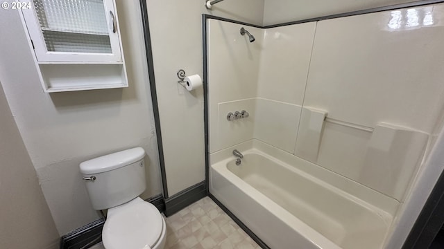 bathroom featuring toilet and washtub / shower combination