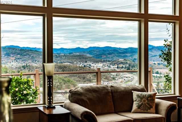 sunroom / solarium with a mountain view