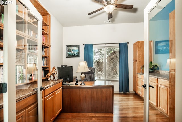 office featuring hardwood / wood-style flooring and ceiling fan