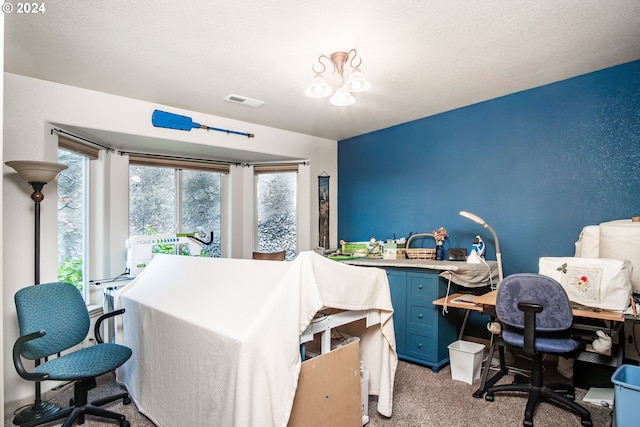 carpeted bedroom with a textured ceiling