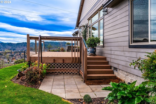 exterior space featuring a lawn and a mountain view