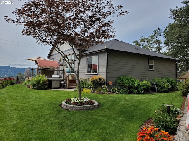 exterior space featuring a mountain view and a hot tub