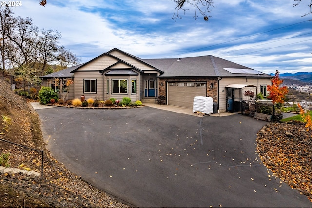 view of front of house featuring a mountain view and a garage