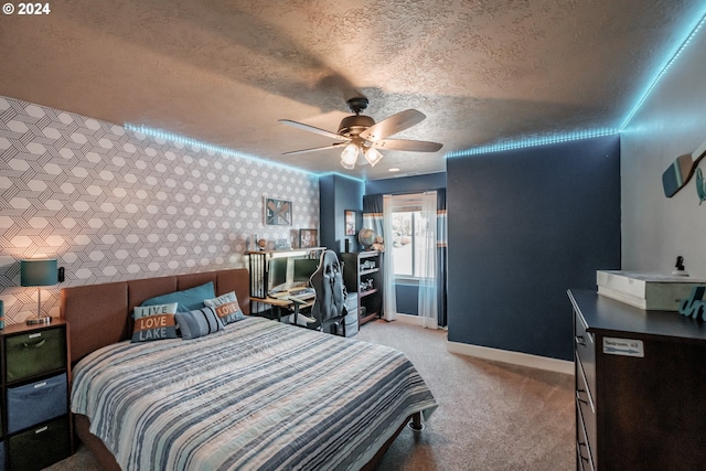 carpeted bedroom with a textured ceiling and ceiling fan