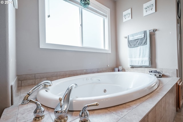 bathroom featuring tiled tub