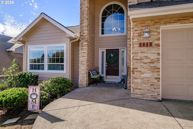 doorway to property featuring a garage