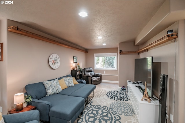 living room featuring a textured ceiling