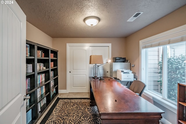 home office with a textured ceiling