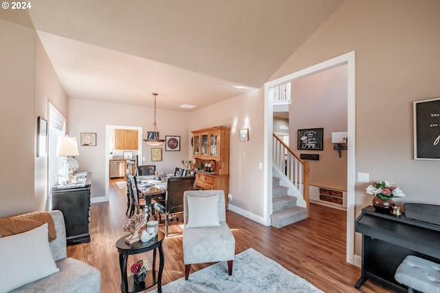 living room featuring hardwood / wood-style floors and vaulted ceiling