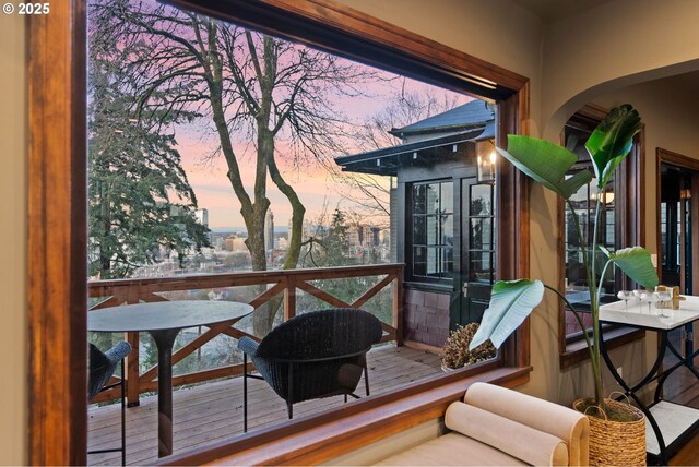 sunroom / solarium featuring a wealth of natural light and vaulted ceiling