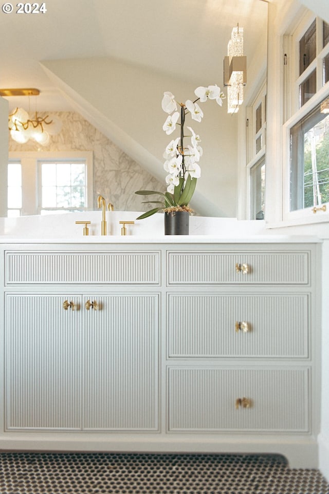 bathroom with lofted ceiling