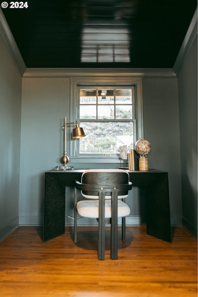 bar featuring hardwood / wood-style floors and ornamental molding