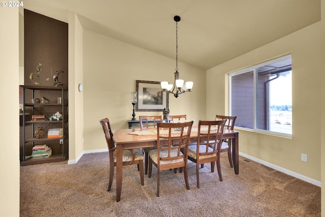 dining space featuring a chandelier, carpet, and vaulted ceiling