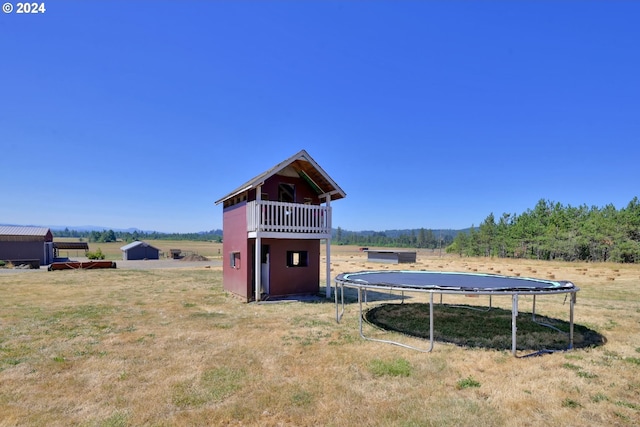 exterior space with a rural view and a trampoline