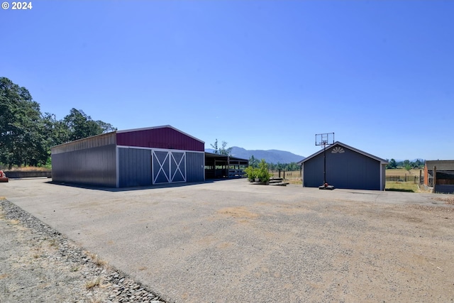 view of outbuilding with a mountain view