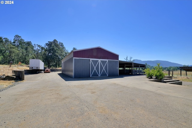 view of outdoor structure with a mountain view